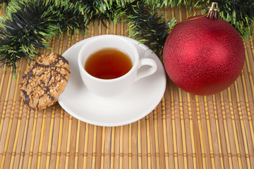 cake and cup of tea with christmas decoration