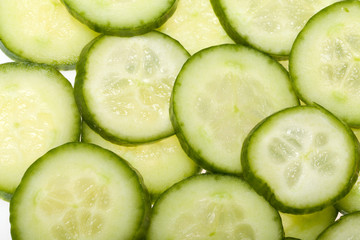 Freshly sliced cucumber  isolated on white background