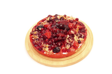 Image of appetizing berry tart on cutting board