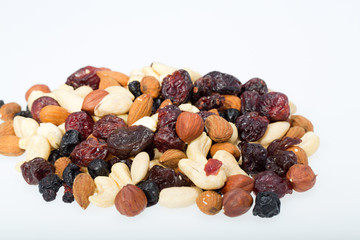mixed nuts and dried fruits isolated on white background