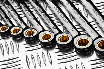 Set of wrenches on metal
