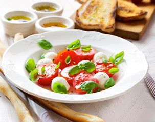 Caprese salad, cherry tomato, mozzarella and basil
