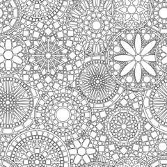 Lacy circle flower mandalas seamless pattern in black and white