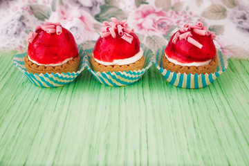 Mini tarts with cream filling and berry glaze