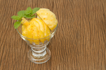 Pineapple slice in the glass with mint