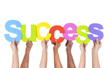 Group Of People Holding The Word Success