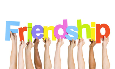 Multiethnic Group of People Holding Word Friendship - obrazy, fototapety, plakaty