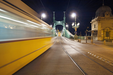 Blurred tram and Liberty Bridge, Budapest by night