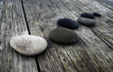 Smooth Pebbles on Old Wooden Pier