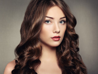 Portrait young beautiful woman with curly hair