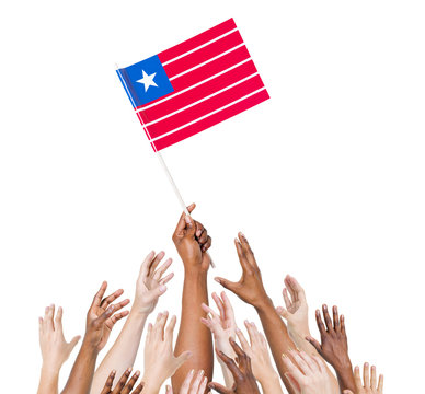 Group Diverse Hands Holding The Flag of Liberia