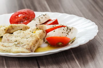roasted fish and Italian caprese salad