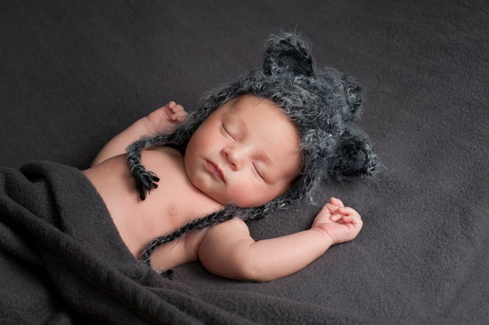 Sleeping Newborn Baby Boy with Wolf Hat