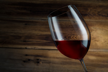 glass of wine on a wooden background
