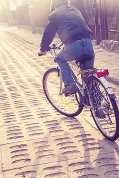 Teenager Riding Bike On Street