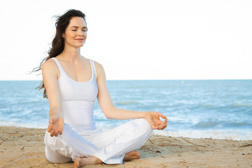 Fototapeta na wymiar Beautiful young woman meditating