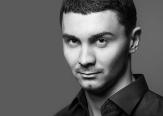 Portrait of a smart serious young man
