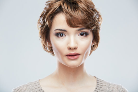 Young Woman Close Up Face Beauty Portrait On White Background.