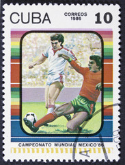 Stamp printed by CUBA shows football players.