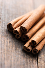 Cinnamon sticks on rustic wooden table