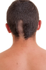 Obraz premium Closeup of the back of man head while his hair is cut isolated o