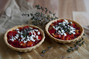 two tartellettes red peppers greek cheese black sesame and thyme