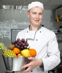 chef preparing food in the kitchen at the restaurant
