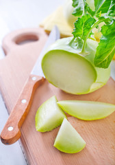 Cabbage kohlrabi on Wooden Kitchen Board