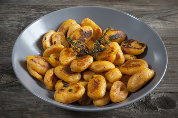 pumpkin dumplings italian gnocchi with thyme on plate