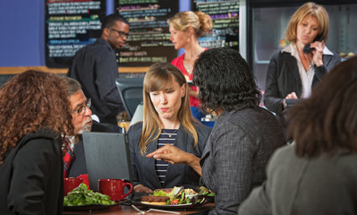 Skeptical Business Woman with Group