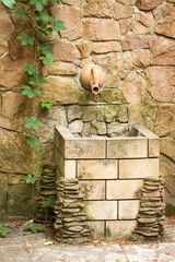 Jar in stone. Wash hand stand.