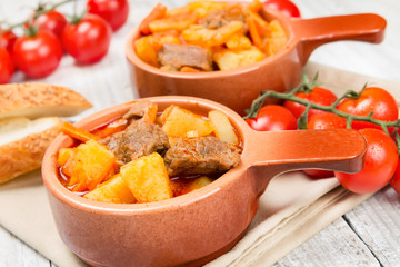 Stewed potatoes in ceramic bowl