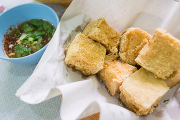Fried tofu with sweet sauce.