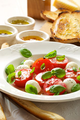 Caprese salad; mini mozzarella, cherry tomatoes and basil