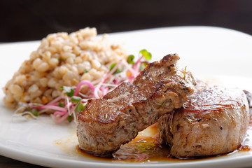 Grilled pork tenderloin with prunes and buckwheat