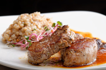 Grilled pork tenderloin with prunes and buckwheat