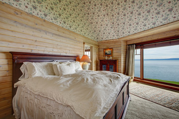 Impressive spacious bedroom with an amazing window view