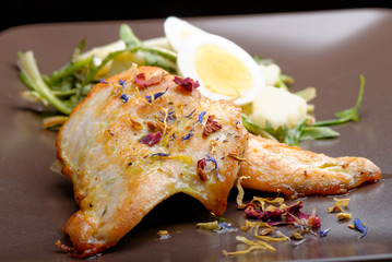 Grilled chicken fillet and dandelions with egg