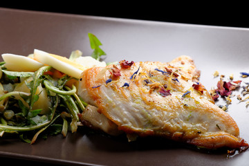 Grilled chicken fillet and dandelions with egg