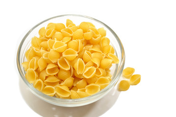 A Glass Bowl with Dry Shell Pasta
