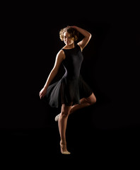 Ballerina on black background