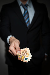 Business man loaning money © francescopaoli