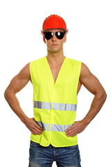 Young worker at protective helmet and work vest