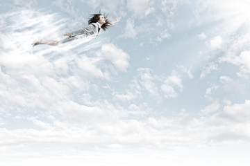Fototapeta premium Flying businesswoman