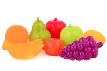 colorful plastic food over white background