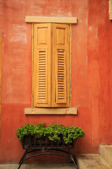 Obraz na płótnie Canvas Wooden flower pot near a window