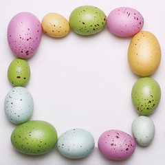 Easter eggs frame on white background.