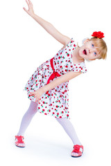 Cheerful little girl with red rose, braided hair, joking in the