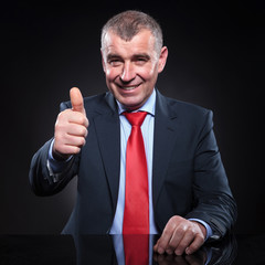 mature business man making the ok sign