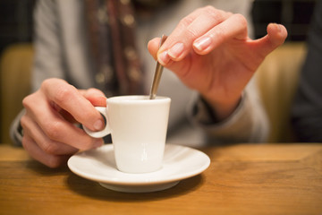 Close up of hands woman and cup of coffee